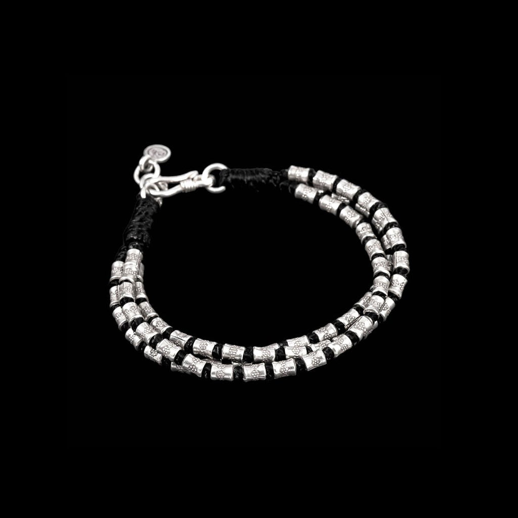 Bracelet souple en argent N°06 - Itsara bijoux13 cmBracelet artisanal souple N°06 en coton ciré avec perles poinçonnées et patinées en argent massif