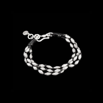 Bracelet souple en argent massif composé de trois fils de coton ciré noir pour femme