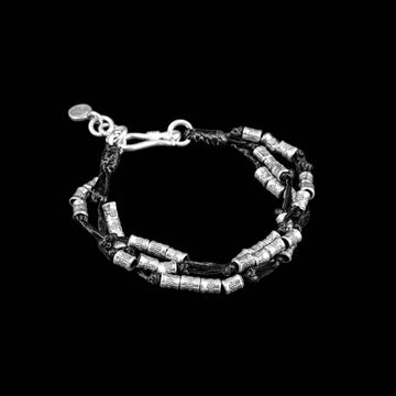 Bracelet souple en argent N°22 - Itsara bijoux13.5 cmbracelet souple argent N° 22 en fils de coton ciré et petites perles d'argent patinées