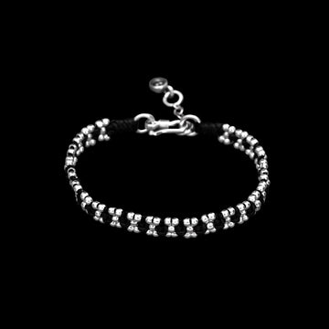 Bracelet souple en argent N°40 - Itsara bijoux13 cmBracelet artisanal souple N°40 en macramé de coton ciré plat avec perles rondes en argent massif